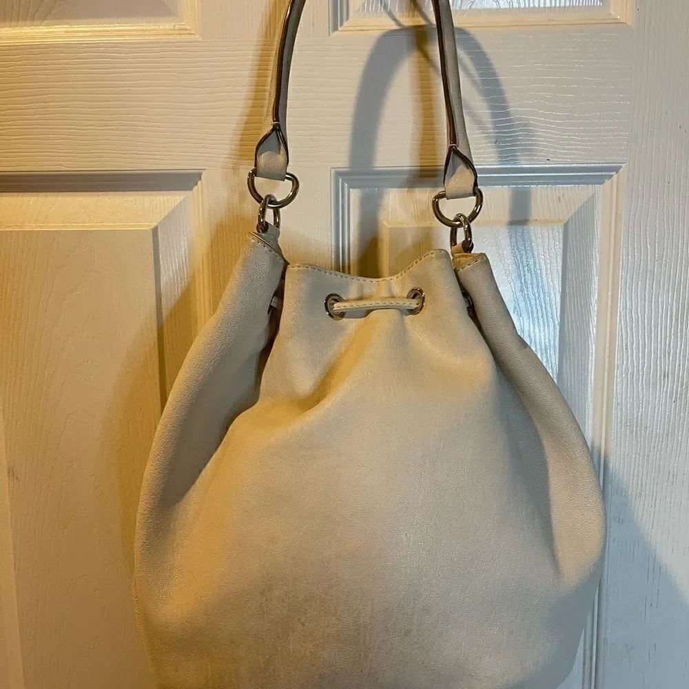 Michael Michael Kors leather beige drawstring bucket satchel.silver tone accents